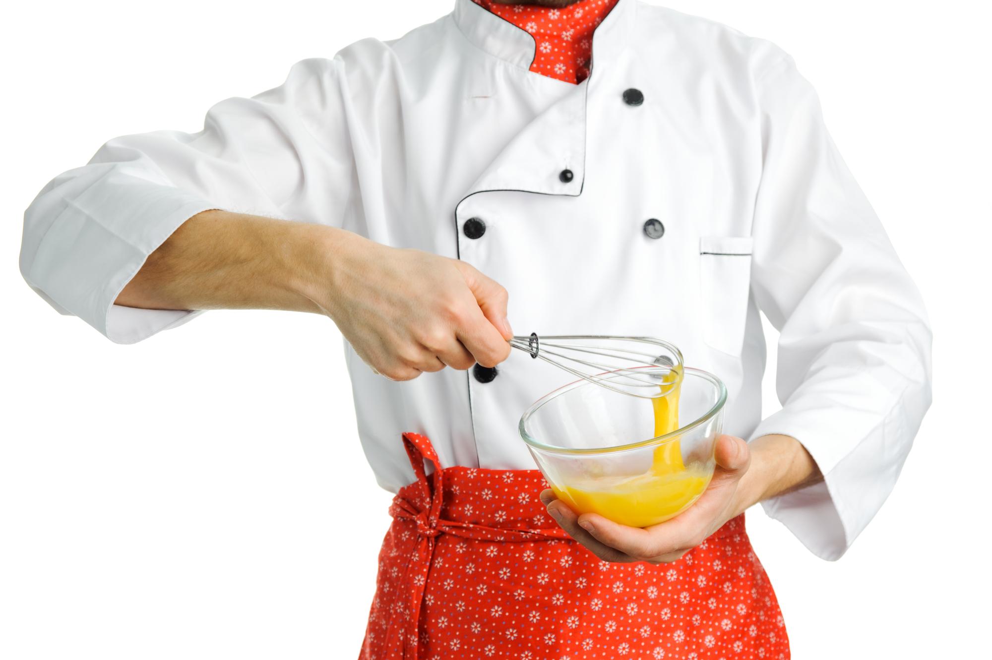 Instructor guiding student in kitchen